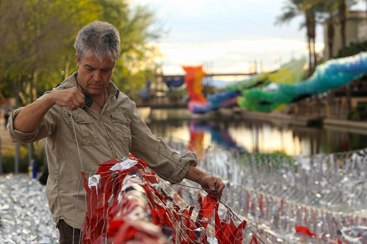 Patrick Shearn hand-rigging a Skynet aerial sculpture on site